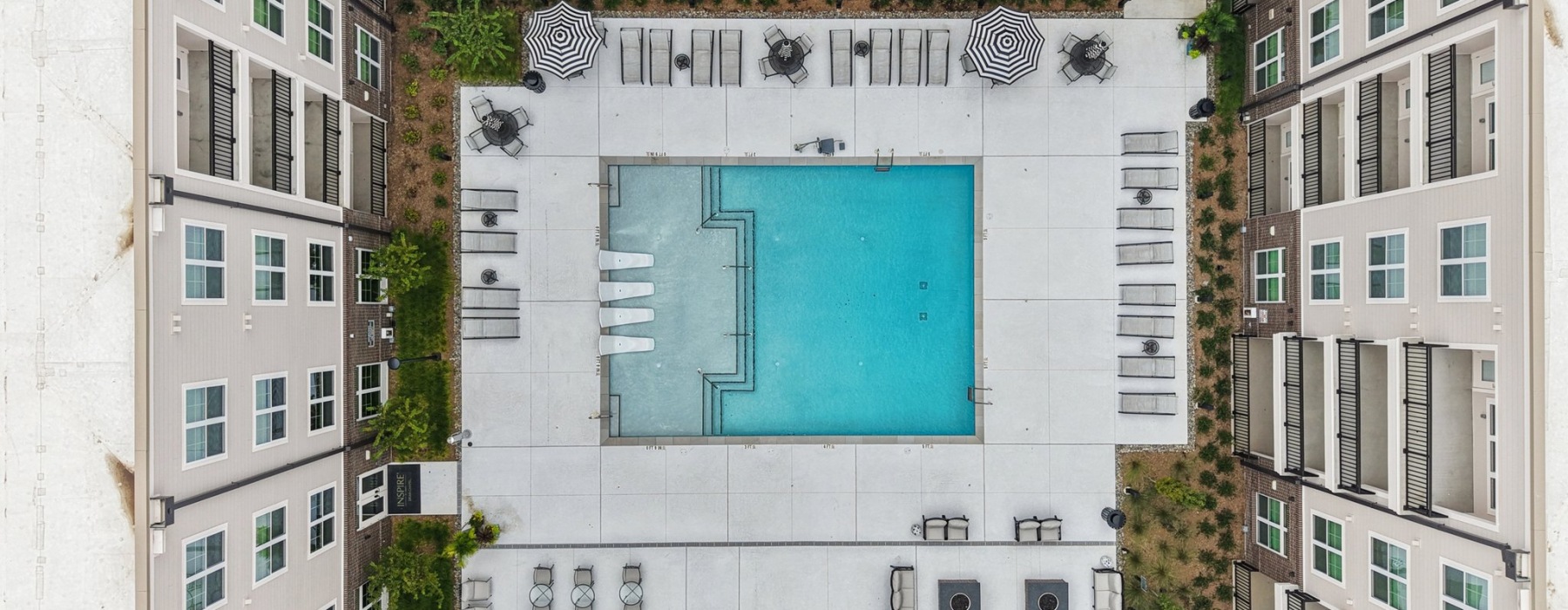 a pool in front of a building