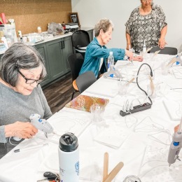 a group of people working on crafts