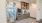 a kitchen with a glass door
