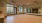 a large empty room with a few windows