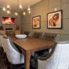 a room with a large table and chandelier 